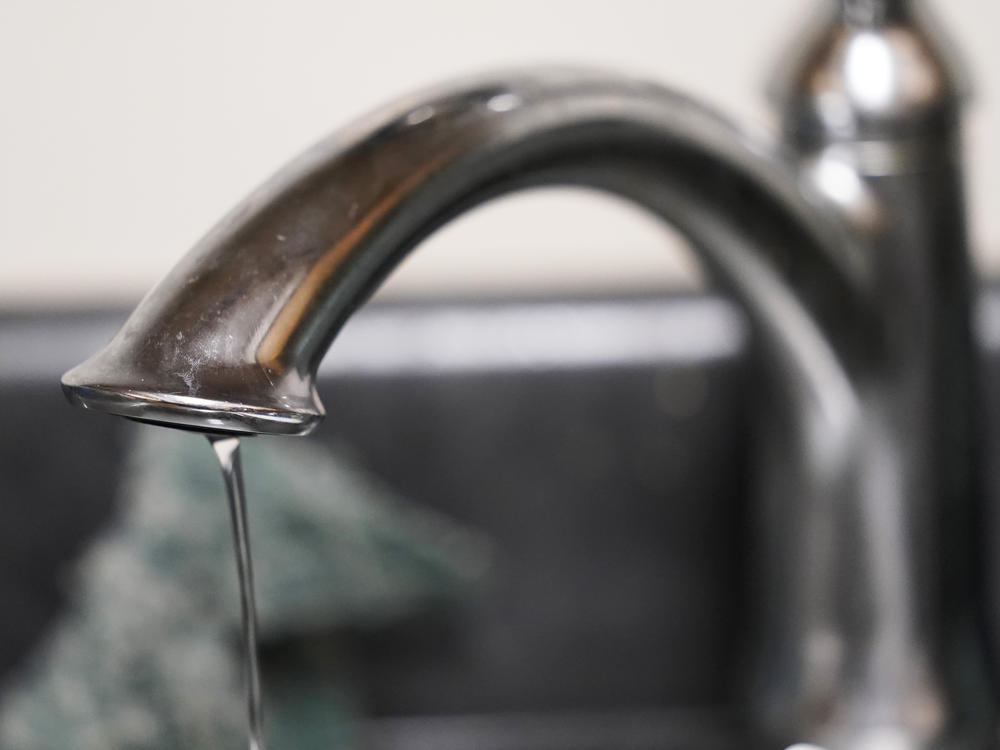 A trickle of water comes out of the faucet in a Senior Living apartment in Jackson, Miss., earlier this month. A recent flood worsened Jackson's longstanding water system problems.