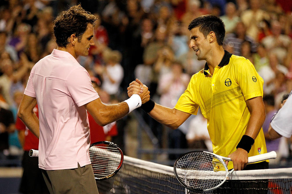 <strong>August 14, 2010:</strong> Roger Federer of Switzerland is congratulated at the net by Novak Djokovic of Serbia after their match during the semifinals of the Rogers Cup at the Rexall Centre in Toronto, Canada.