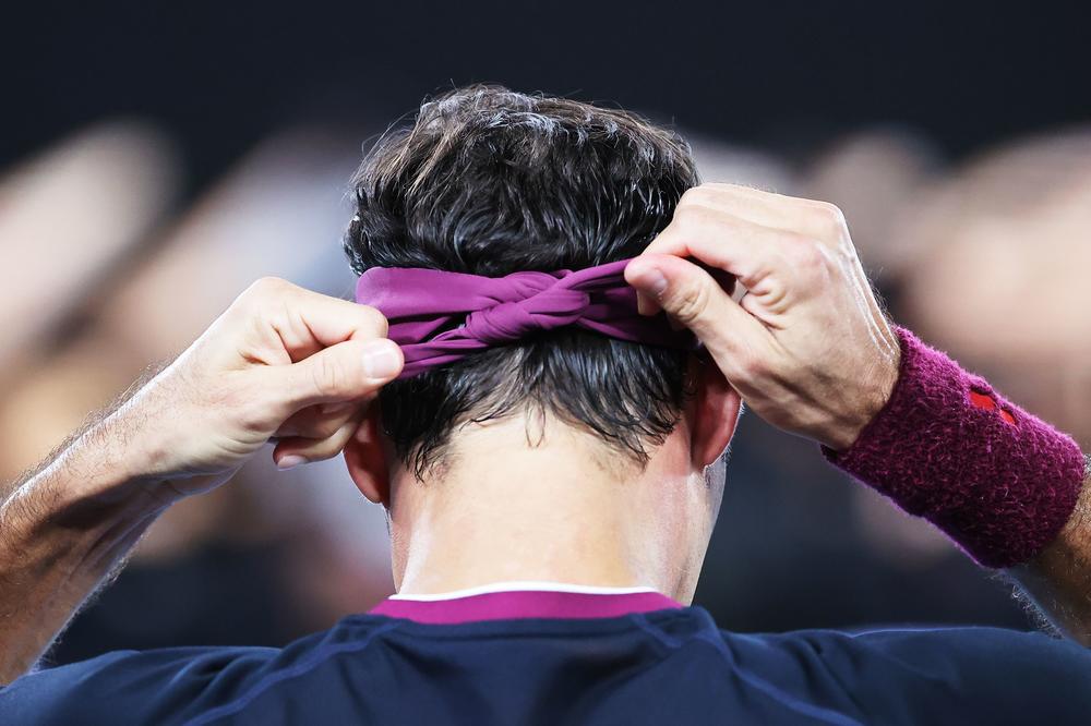 <strong>January 30, 2020:</strong> Switzerland's Roger Federer ties his head band during a break in his men's singles semi-final match against Serbia's Novak Djokovic on day eleven of the Australian Open tennis tournament in Melbourne.