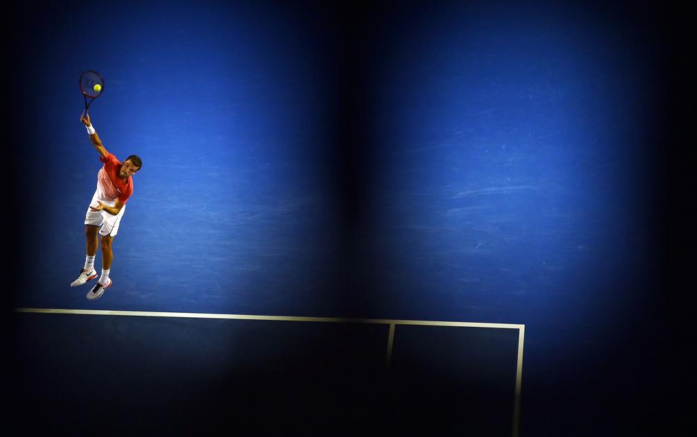 <strong>January 22, 2016:</strong> Bulgaria's Grigor Dimitrov serves against Switzerland's Roger Federer during their men's singles match on day five of the 2016 Australian Open tennis tournament in Melbourne.