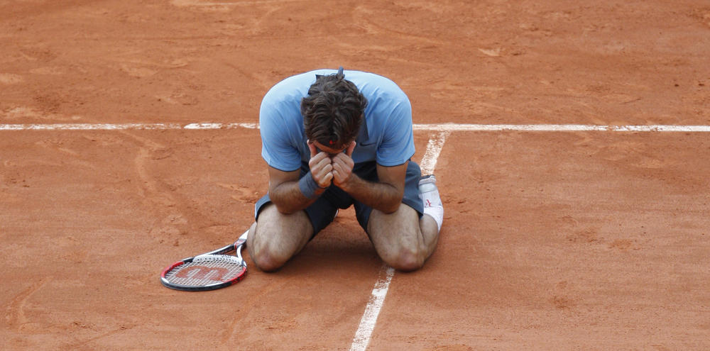 <strong>June 7, 2009:</strong> Switzerland's Roger Federer jubilates after defeating Sweden's Robin Soderling during their men's singles final match of the French Open tennis tournament at the Roland Garros stadium in Paris.
