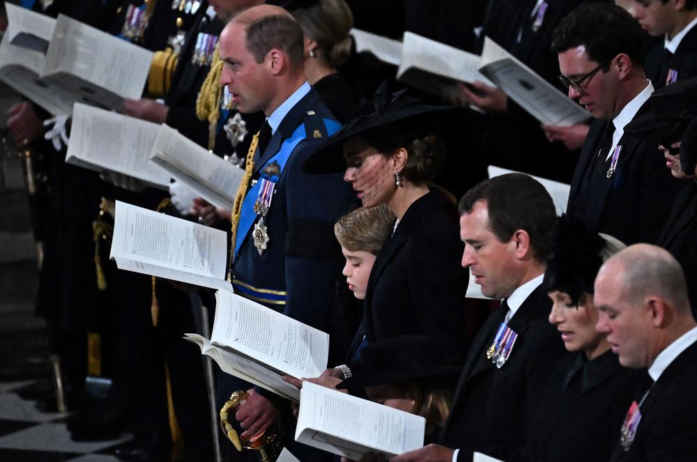 Britain's Prince William, Prince of Wales (L), Britain's Prince George of Wales (C) and Britain's Catherine, Princess of Wales attend the State Funeral Service for Britain's Queen Elizabeth II.