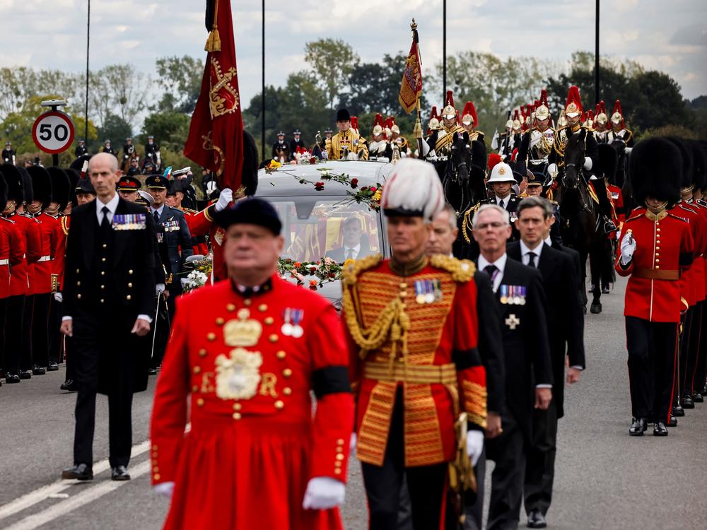 The Procession following the coffin of Queen Elizabeth II, in the State Hearse, arrives at The Long Walk in Windsor on Monday to make its final journey to Windsor Castle after the State Funeral Service.