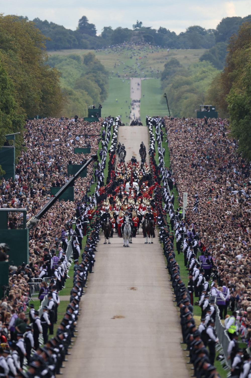 The procession following the coffin of Queen Elizabeth II, aboard the State Hearse, travels up The Long Walk in Windsor on Monday, making its final journey to Windsor Castle after the State Funeral Service.