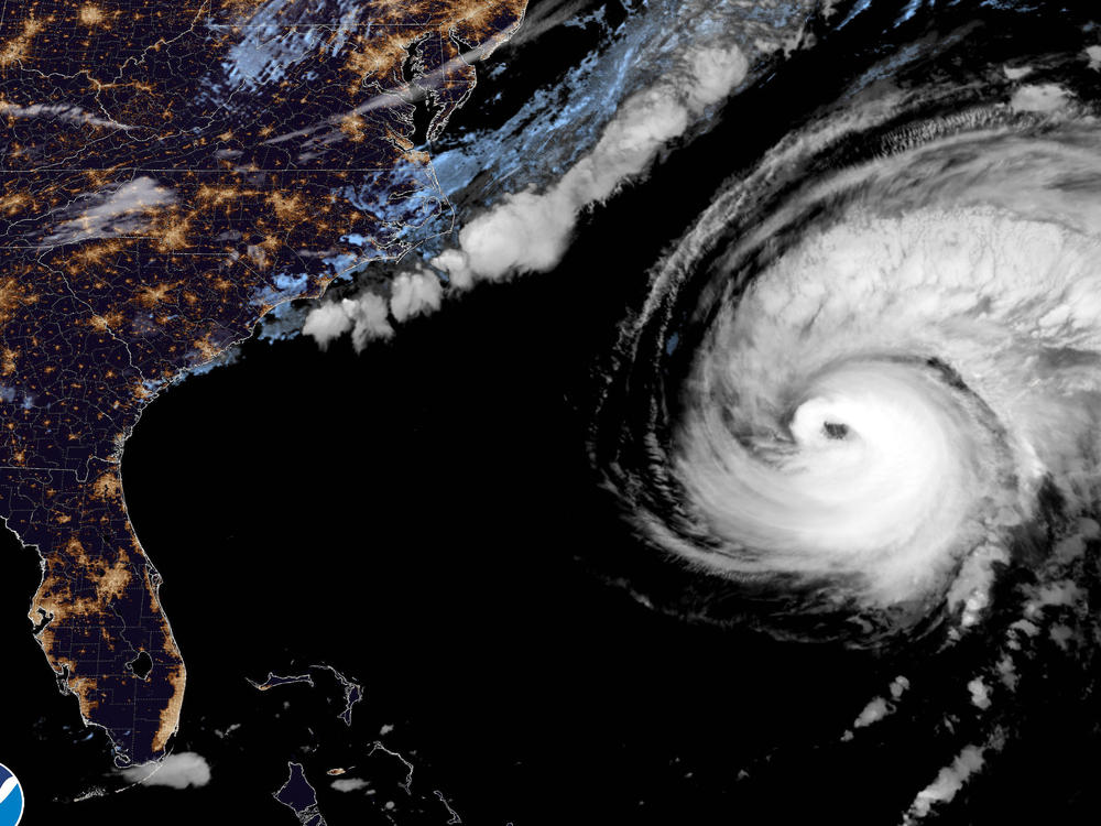 This image provided by the National Hurricane Center National Oceanic and Atmospheric Administration shows a satellite view as Hurricane Fiona moves up the United States Atlantic coast, Thursday night, Sept. 22, 2022.