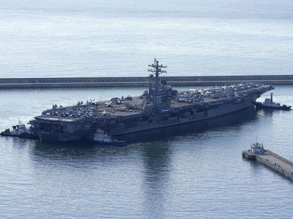 The U.S. carrier USS Ronald Reagan is escorted as it arrives in Busan, South Korea, on Sept. 23. North Korea warned on Saturday that the U.S. redeployment of the carrier near the Korean Peninsula is causing a 
