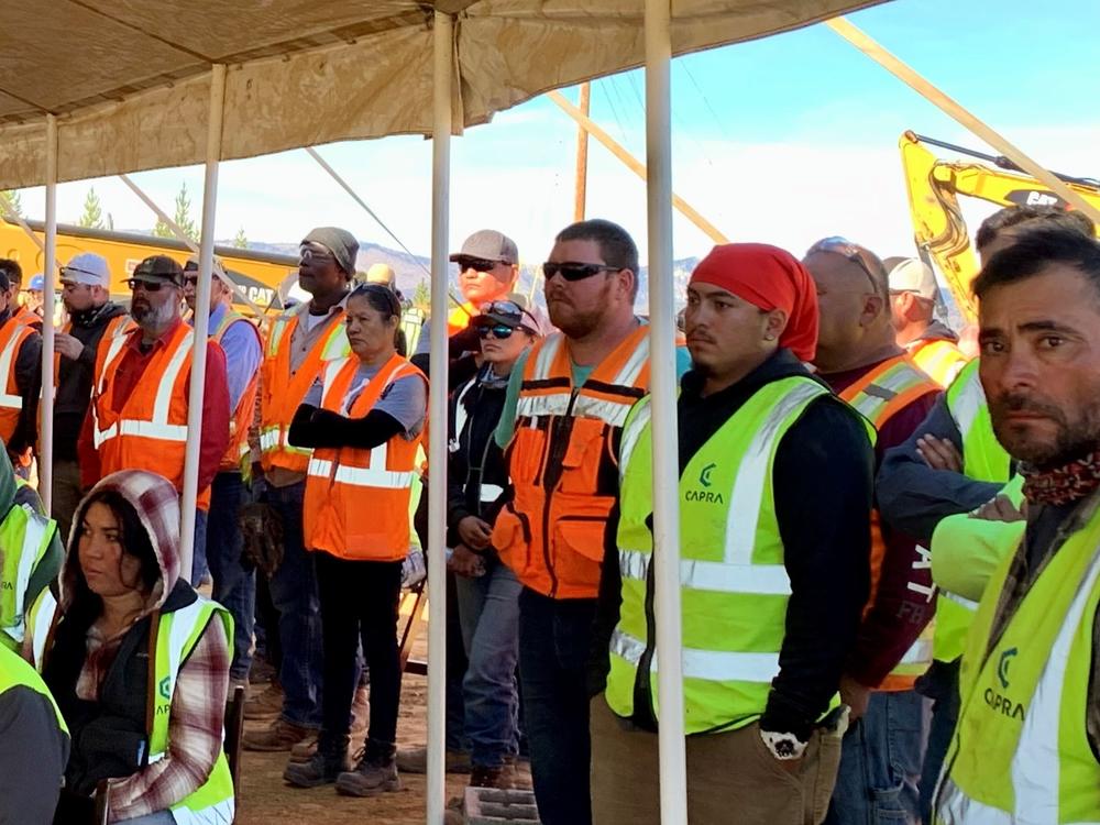 Workers at Idaho Cobalt Operations watch a ceremony opening the mine on Oct. 7.