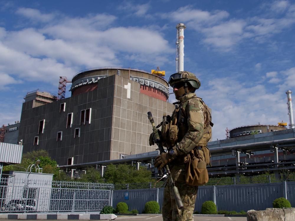 A Russian service member patrols the Zaporizhzhia nuclear power plant in May.