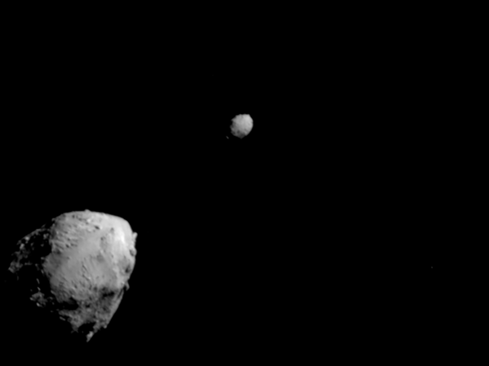 Asteroid Didymos (bottom left) and its moonlet, Dimorphos, about 2.5 minutes before the impact of NASA's DART spacecraft.