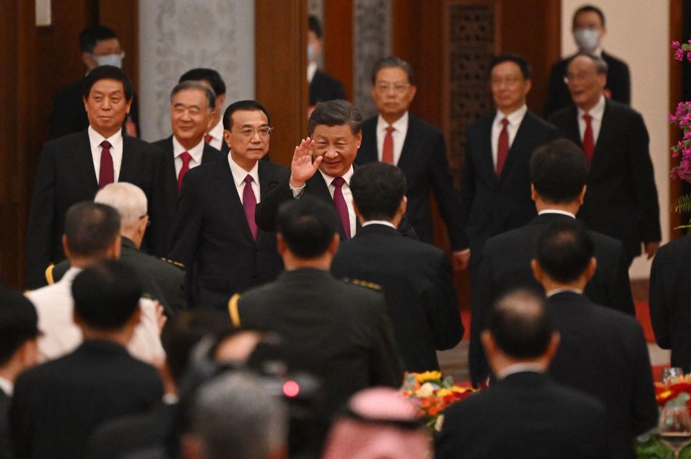 Chinese President Xi Jinping (center) and Chinese Premier Li Keqiang (third from left) arrive for a reception at the Great Hall of the People on the eve of China's National Day in Beijing on Sept. 30.