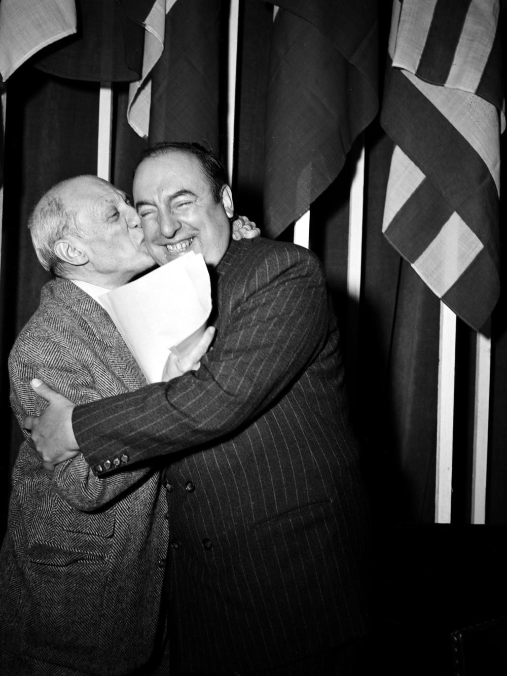 Pablo Picasso (left) embraces Pablo Neruda at the end of the Congress of Partisans of Peace in Paris in 1949.