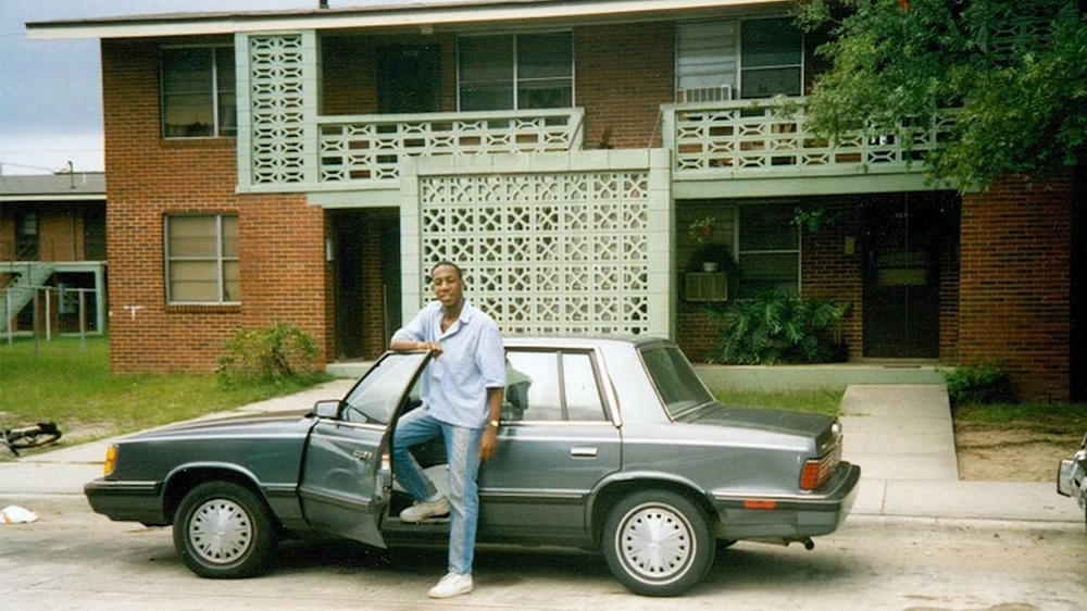 An undated photo of young Sen. Raphael Warnock (D-Ga.) outside the public housing complex where he grew up