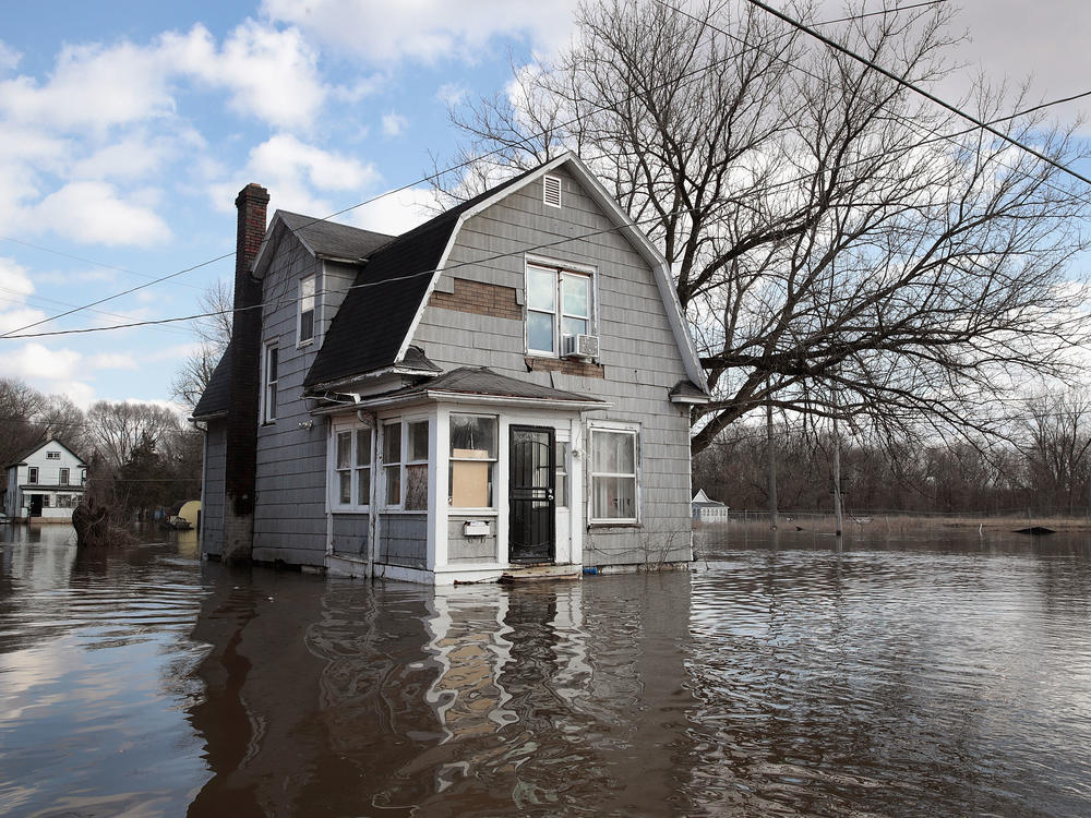 A home is surrounded by floodwater from the Pecatonica River in Freeport, Illinois on March 18, 2019.