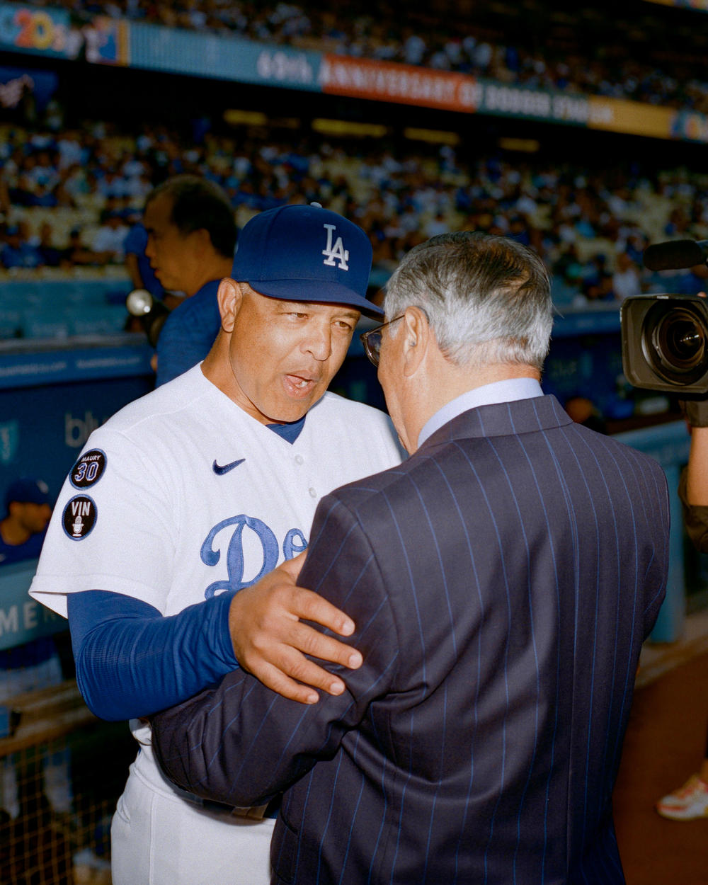 Jarrín is embraced among the team, including Dodgers manager Dave Roberts.