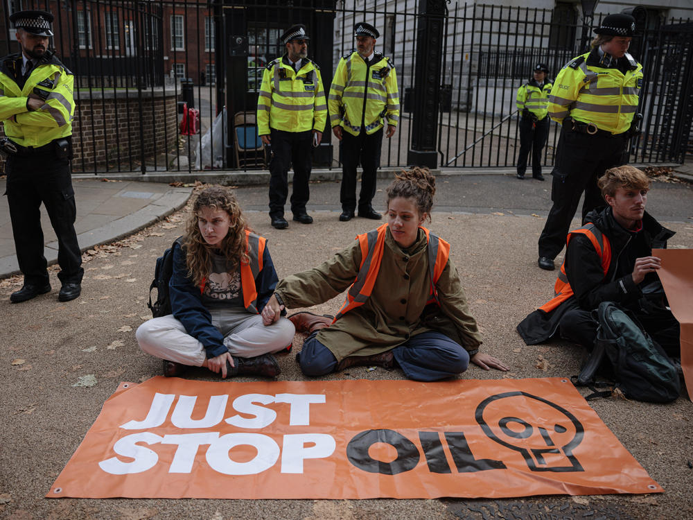 Just Stop Oil protesters block the road at the back of Downing Street on Wednesday in London.