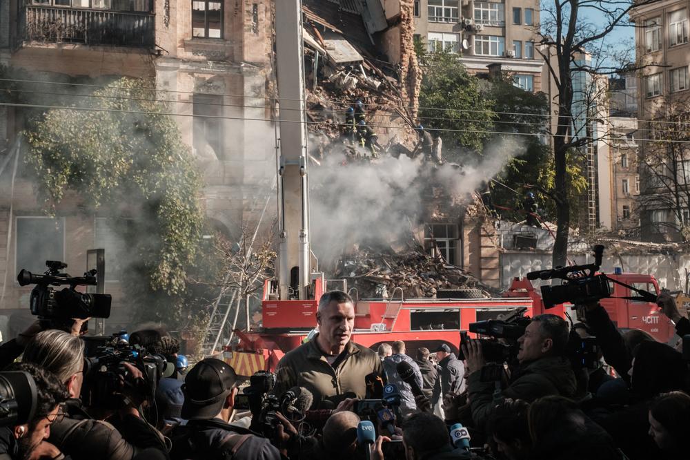 Kyiv Mayor Vitali Klitschko speaks to reporters next to a building destroyed by a drone Monday.