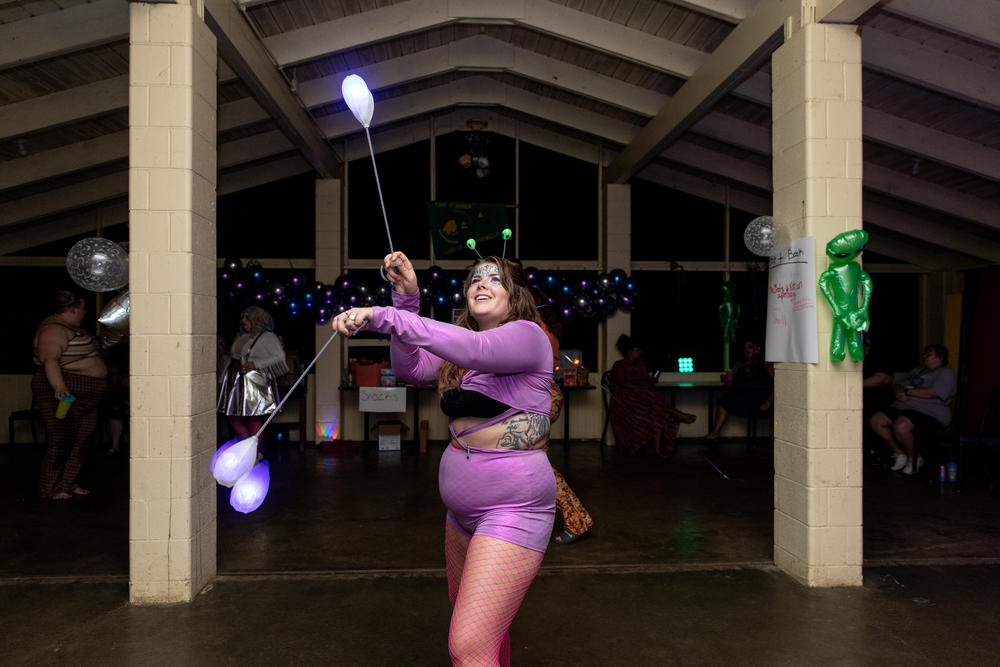 Cat Ruehlman, 32, poi dances during Camp Roundup's space-disco party.