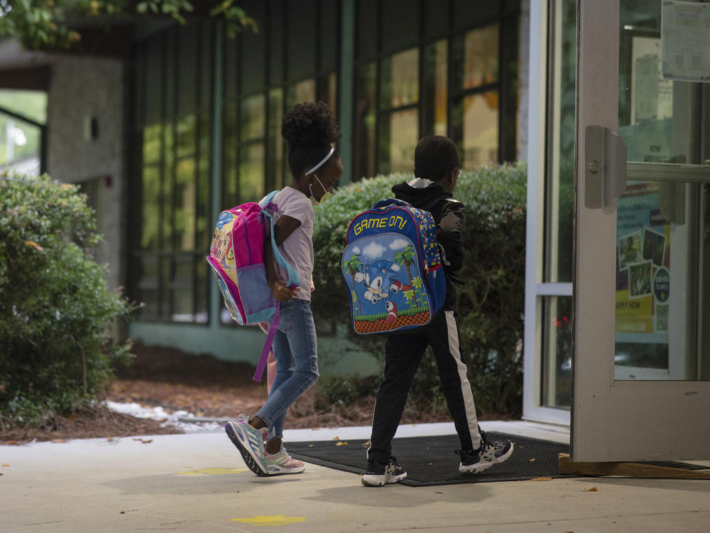 Students enter Atlanta's Beecher Hills Elementary School in August.