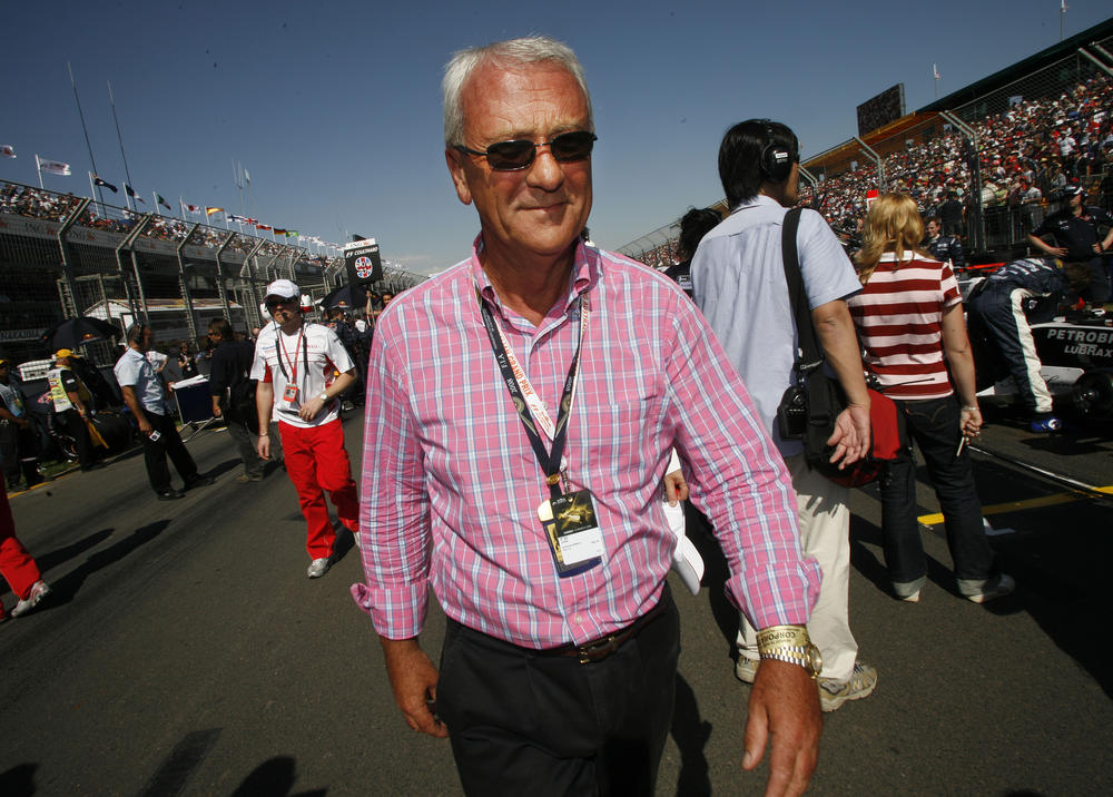 Red Bull and Toro Rosso team owner and founder of the energy drink brand Red Bull, Dietrich Mateschitz, walks the grid prior to the start of the season-opening Australian Grand Prix auto race in Melbourne, Australia, on March 16, 2008.