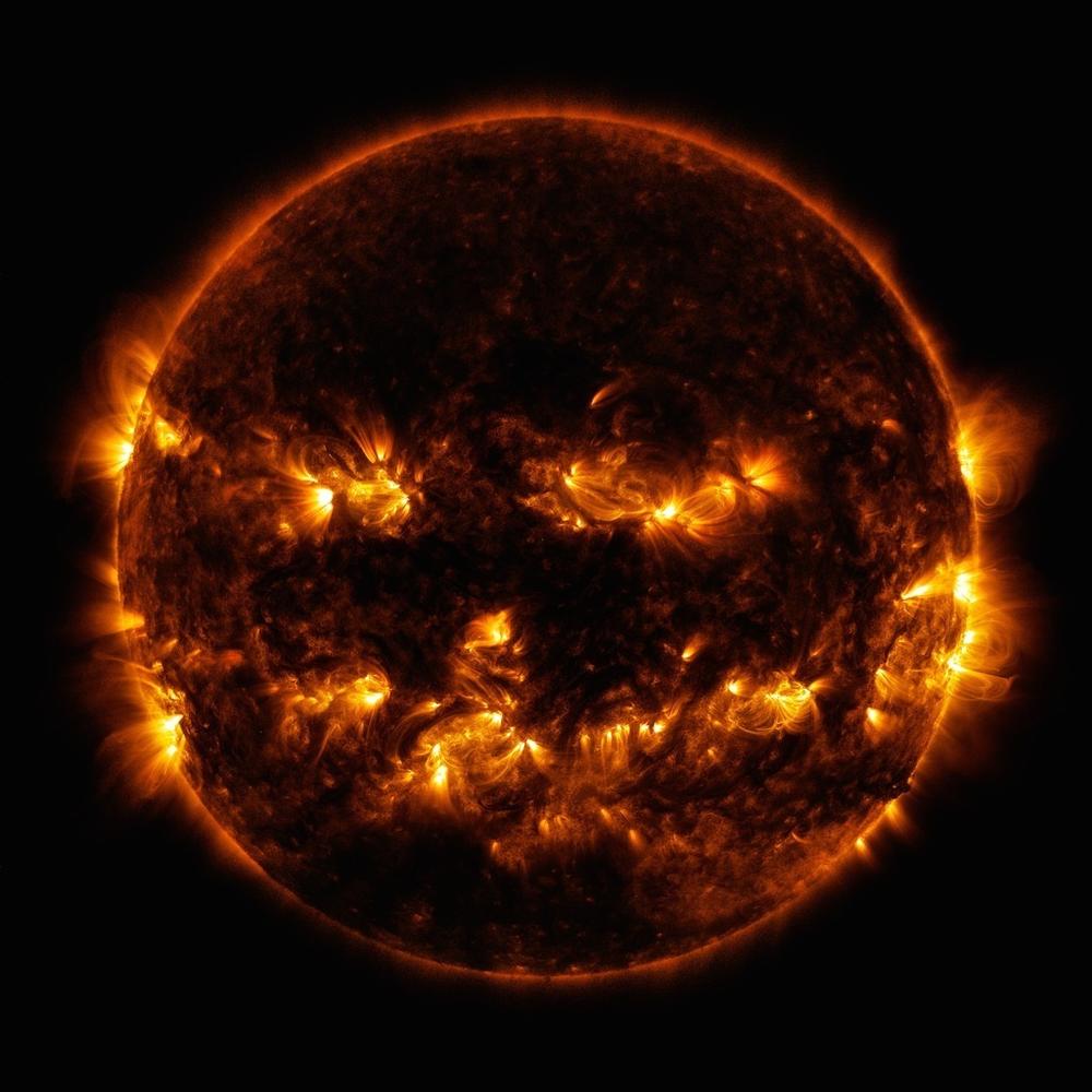 Active regions on the sun gave it the appearance of a jack-o'-lantern. This image is a blend of 171 and 193 angstrom light as captured by the Solar Dynamics Observatory on Oct. 8, 2014.