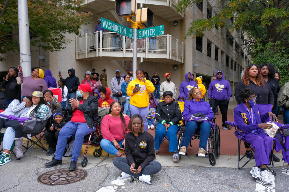 Benedict College alumni and supporters gather to watch the school's homecoming parade in downtown Columbia, S.C., on Oct. 29, 2022.
