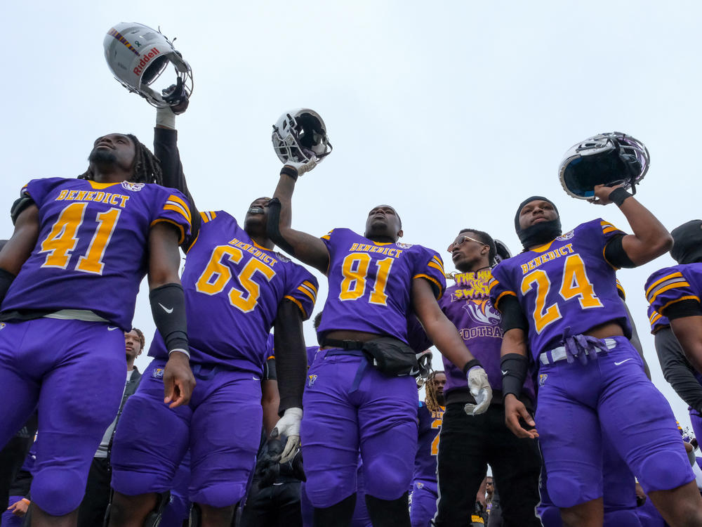 Members of the Benedict Tigers' football team celebrate after their homecoming win against the Clark Atlanta University Panthers on Oct. 29, 2022.