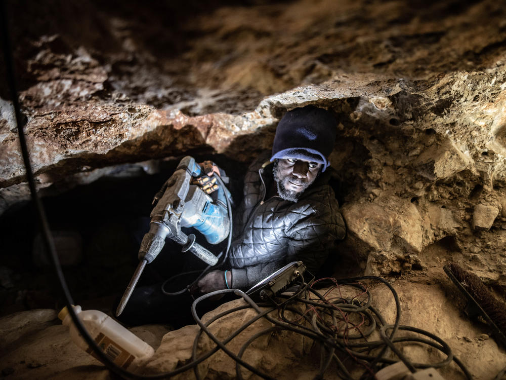 Jefferson Ncube, an illegal diamond miner from Zimbabwe, works on his latest tunnel at an abandoned De Beers mine near Kleinzee, South Africa. Ncube is a univeristy graduate, but has been unable to find employment.