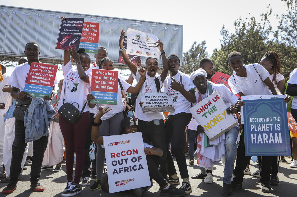 Kenyan activists at a climate protest in September demand more aid for poor countries.