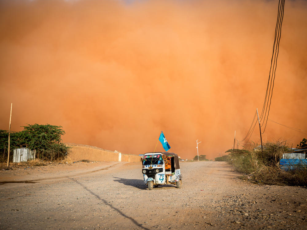 A tuktuk drives during a sandstorm in Somalia in April. The United Nations says a multi-year drought in East Africa is evidence of 
