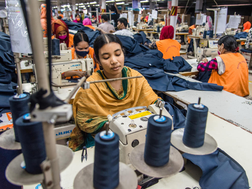 Women manufacture clothes in Dhaka, Bangladesh on Aug. 29. The ready-made garment (RMG) industry in Bangladesh is now a mainstay of the country's economy. Today, Bangladesh is one of the world's largest garment exporters, with the sector accounting for more than 80% percent of Bangladesh's exports.