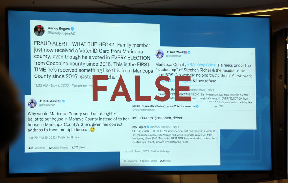 An image depicting false election information is displayed as Stephen Richer, Maricopa Country Recorder, speaks at a press conference on the midterm elections Monday.