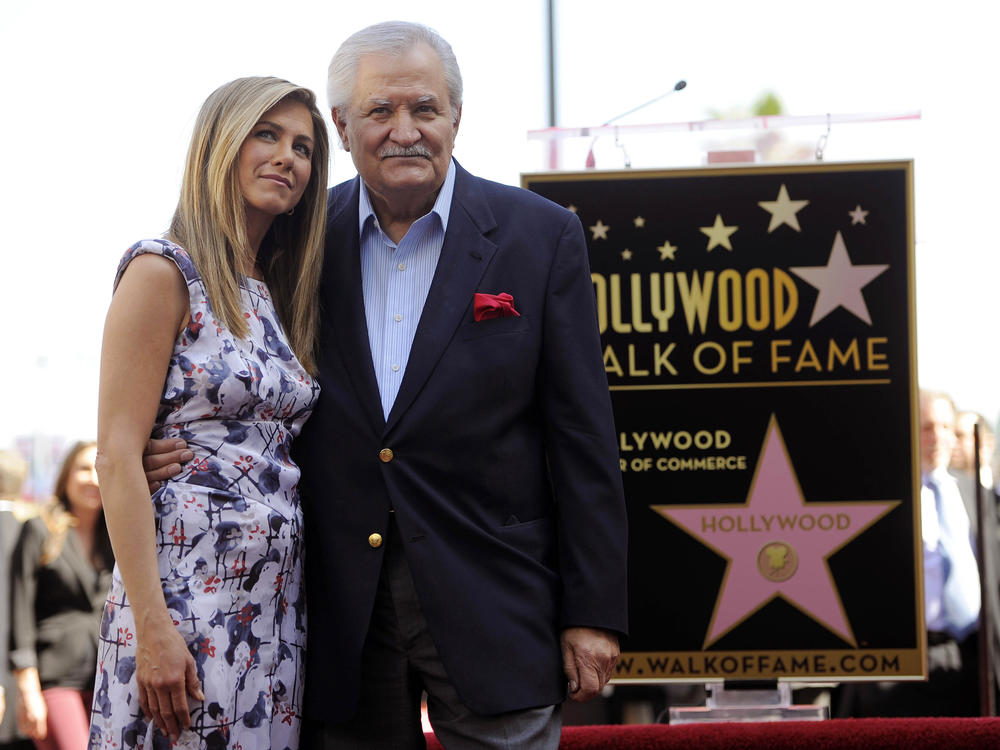 Actress Jennifer Aniston, left, poses with her father, actor John Aniston, after she received a star on the Hollywood Walk of Fame in Los Angeles in 2012. John Aniston, the Emmy-winning star of the daytime soap opera 