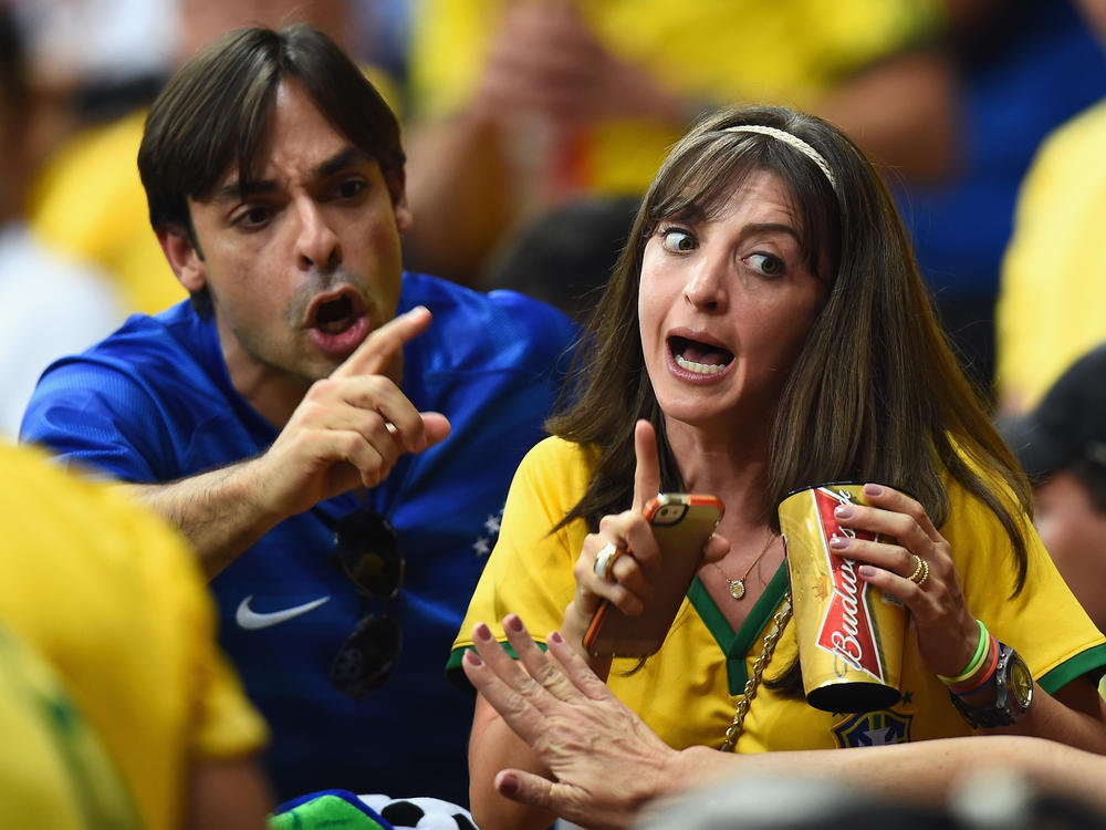 Fans and beers have been a common sight at previous World Cup tournaments, like this 2014 scene from Brasilia, Brazil. But in Qatar, officials revoked a plan to allow regular spectators to drink beers on stadium grounds.