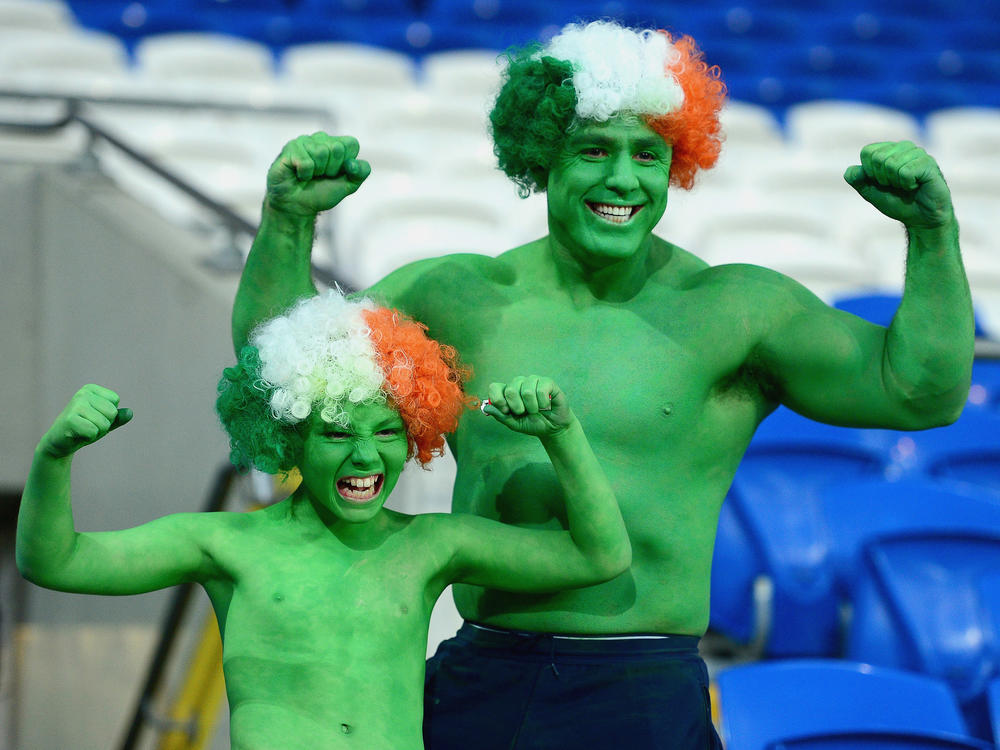 Republic of Ireland fans pose before a FIFA 2018 World Cup qualifier in Cardiff, Wales. When fans head to Qatar, they'll need to keep their stomachs, chests and shoulders covered.