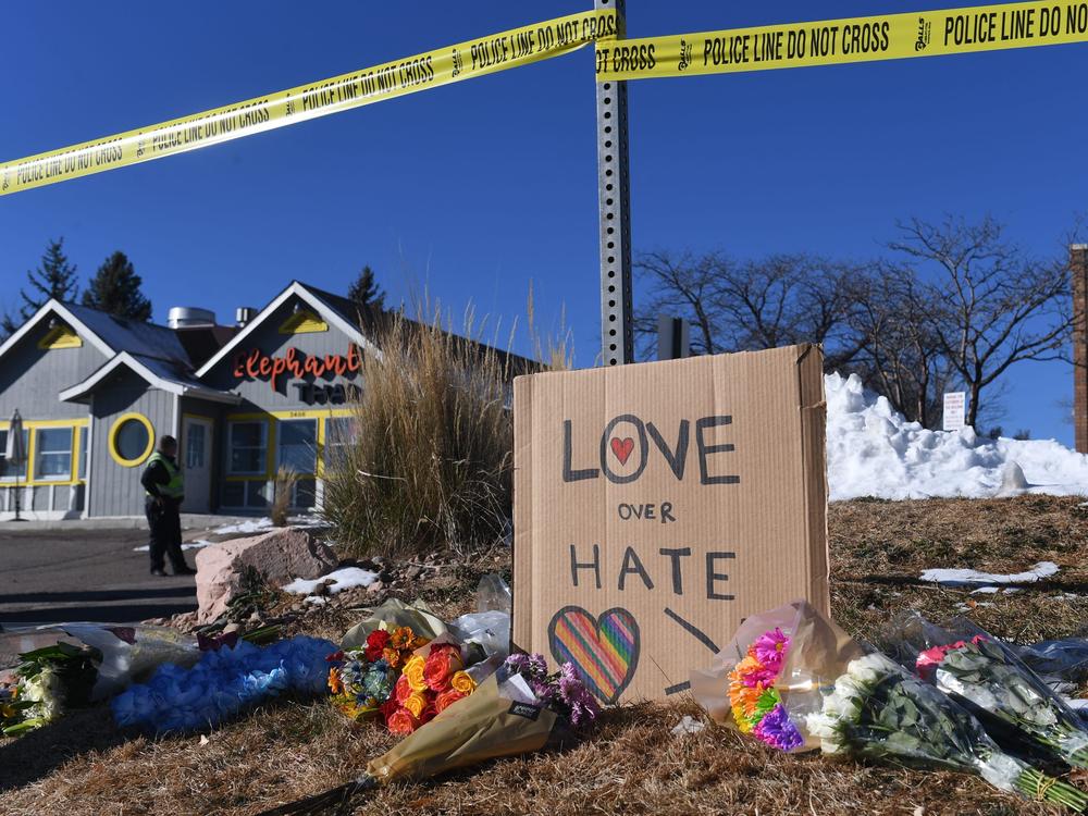 Bouquets of flowers are left near Club Q, an LGBTQ nightclub in Colorado Springs, Colorado. At least five people were killed and 18 wounded in a mass shooting at an LGBTQ nightclub in the US city of Colorado Springs, police said on November 20, 2022.