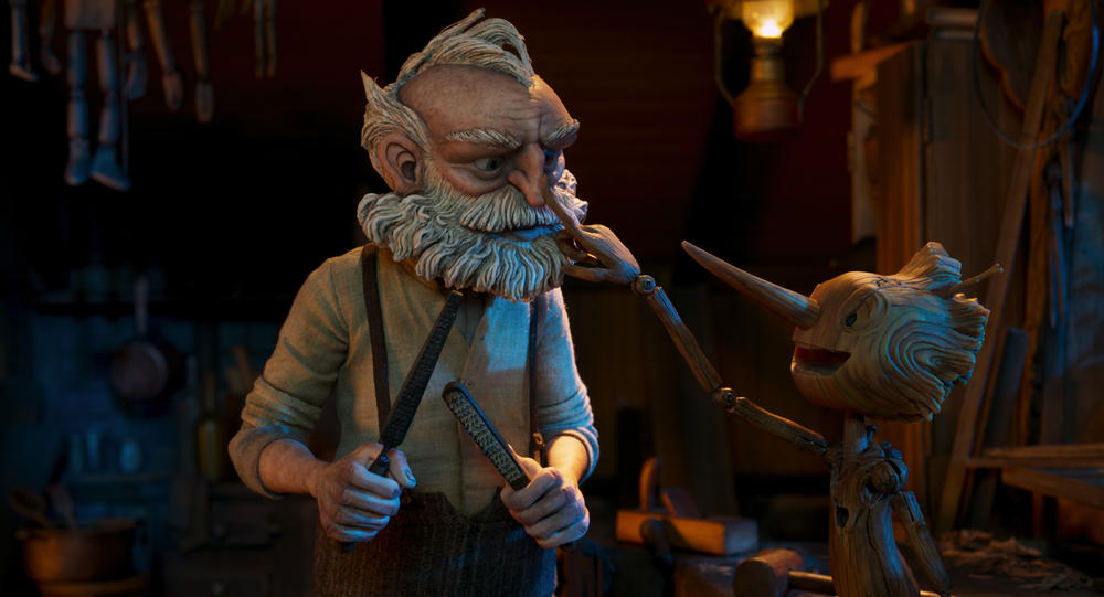 Gepetto (voiced by David Bradley) and Pinocchio (voiced by Gregory Mann) in <em>Guillermo del Toro's Pinocchio.</em>