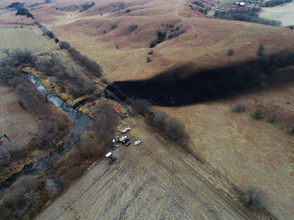 In this photo taken by a drone on Dec. 9, cleanup continues in the area where the ruptured Keystone pipeline dumped oil into a creek in Washington County, Kan.
