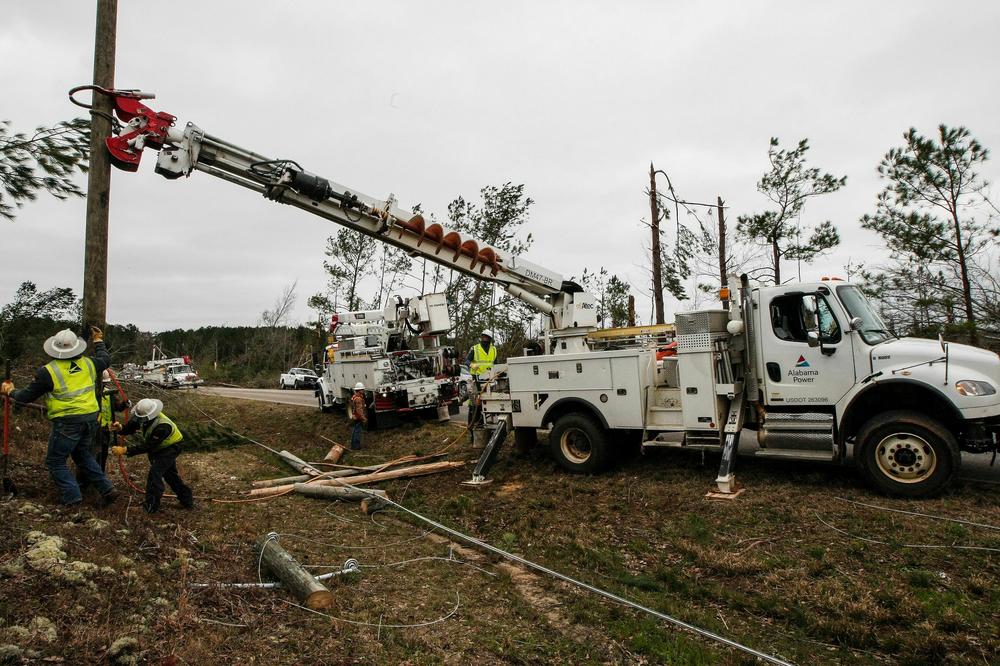 Alabama Power begins putting up poles to get power restored in Beauregard, Ala., after a tornado in 2019. The power company was a client of Matrix.
