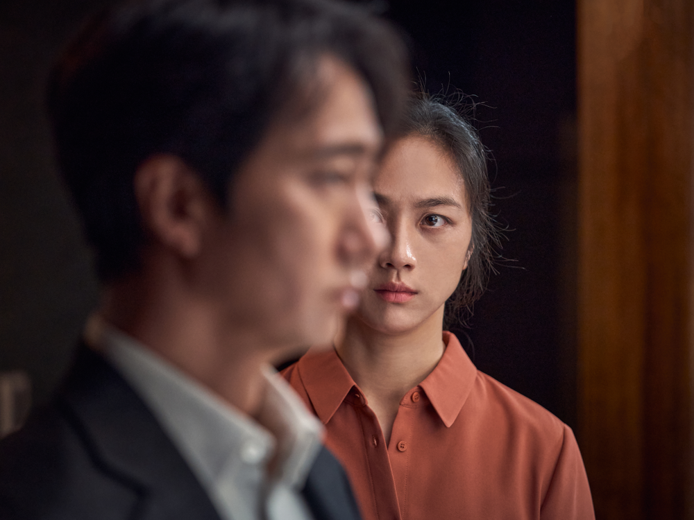 Park Hae-il plays a homicide detective and Tang Wei is the femme fatale he's investigating in<em> Decision to Leave</em>.