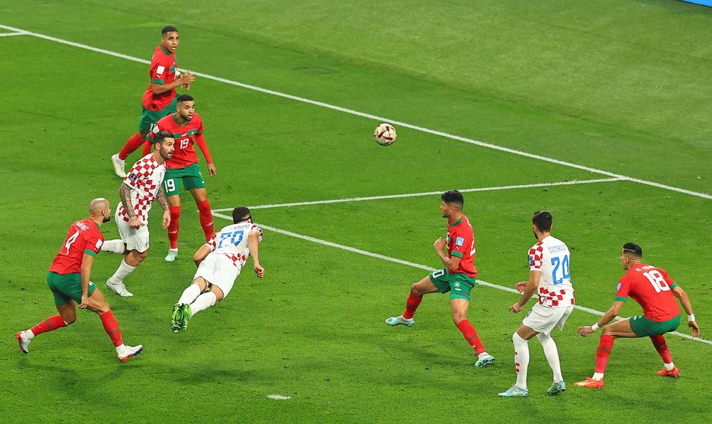 Croatia's Joško Gvardiol heads to score during the 2022 World Cup's third-place play-off match with Morocco on Saturday, Dec. 17, at Khalifa International Stadium in Doha, Qatar.