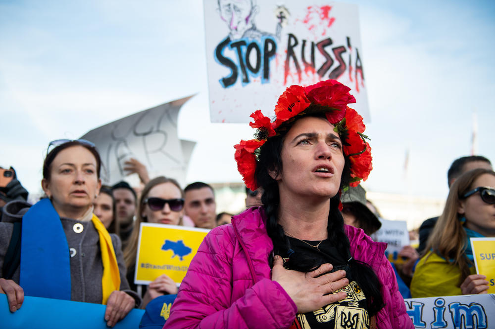Julia Kosivchuk sings the Ukrainian national anthem during a protest in front of San Francisco City Hall on Feb. 24, 2022, against the Russian invasion of Ukraine. Full story <a href=