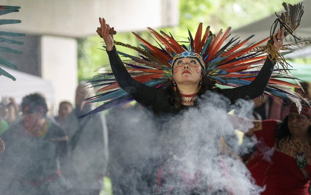 Aztek dancer Maira Barrera Mazatl of Sublimity dances during opening prayers at 