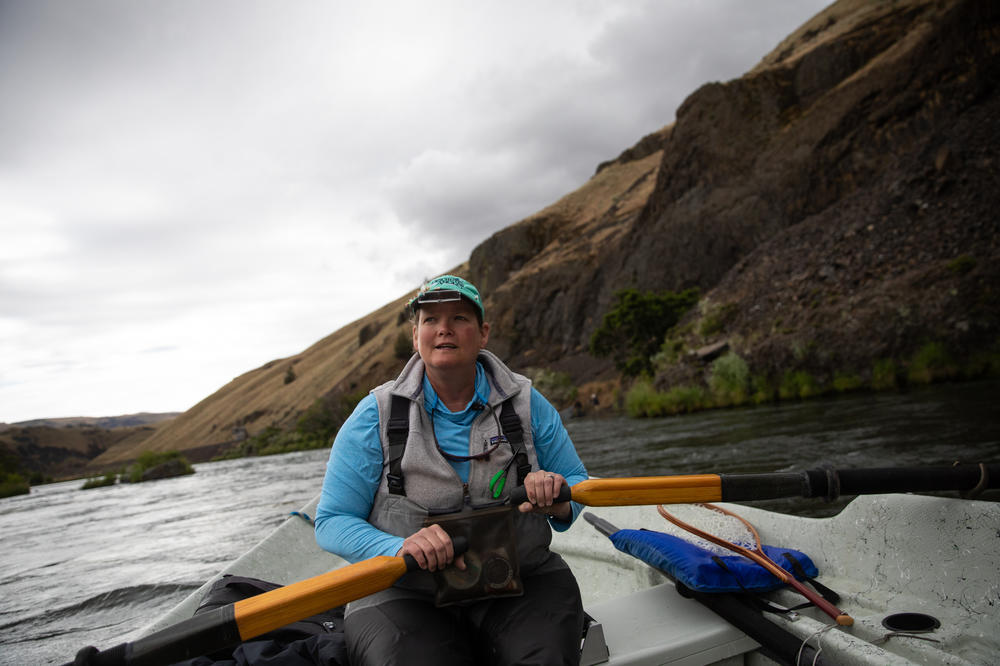 Fishing guide Amy Hazel rows a driftboat on the lower Deschutes River near Maupin, Ore., June 17, 2022. She's been guiding on the river since 1999. Full story <a href=