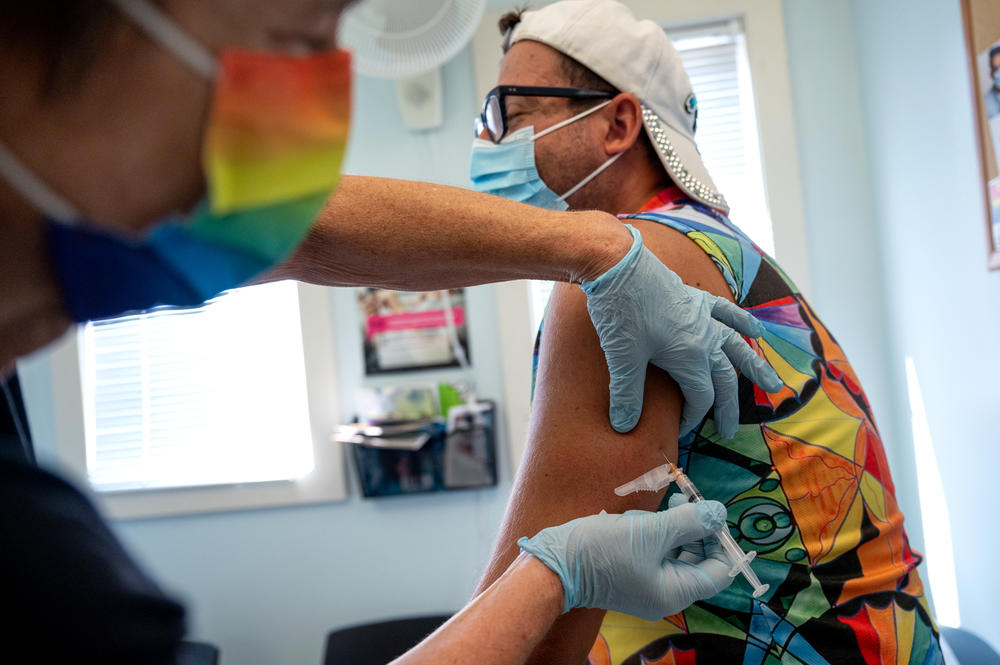 New London resident Christopher Marsala receives a monkeypox vaccine at Fair Haven Community Health Care in New Haven, Conn. Marsala was one of the first people to sign up to get vaccinated. Full story <a href=