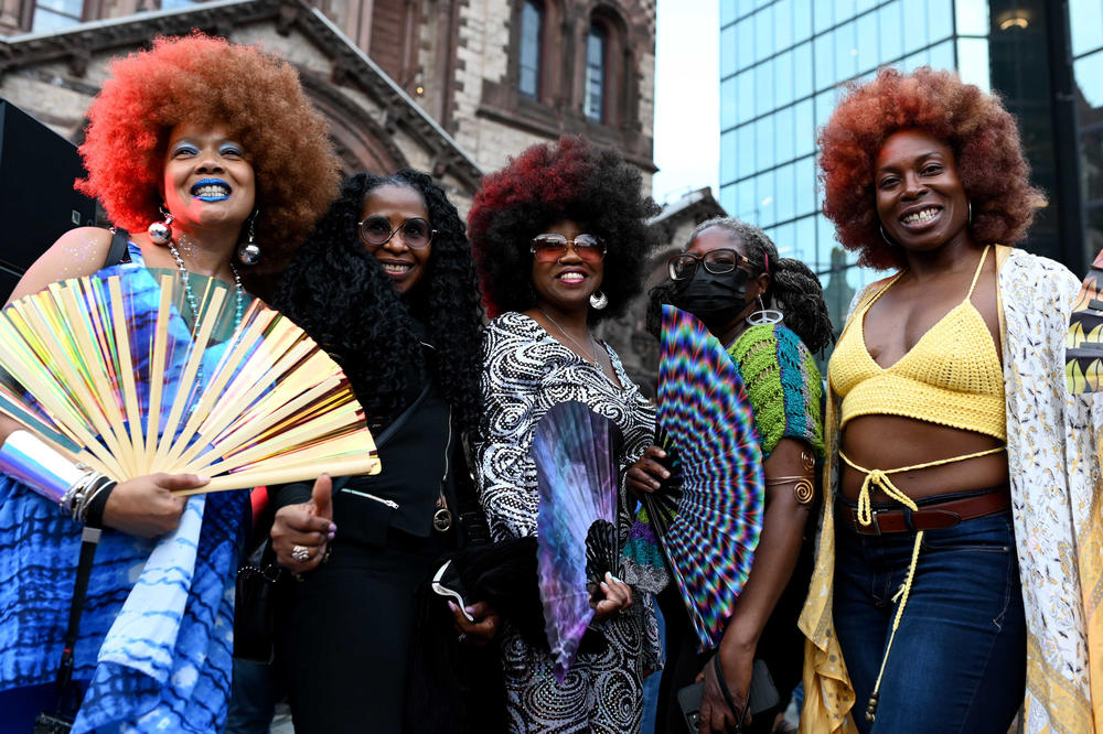 <strong>From left to right: </strong>Jacqueline Myers of Dorchester, Cynthia Sellers of Worcester, Carmen Calloway of San Diego and Angel Green of Boston pose for a photo at Boston's annual Donna Summer Disco Party in Copley Square on June 16, 2022. Full story <a href=