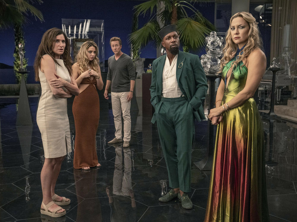 Kathryn Hahn as Claire, Madelyn Cline as Whiskey, Edward Norton as Miles, Leslie Odom Jr. as Lionel, and Kate Hudson as Birdie in <em>Glass Onion: A Knives Out Mystery.</em>