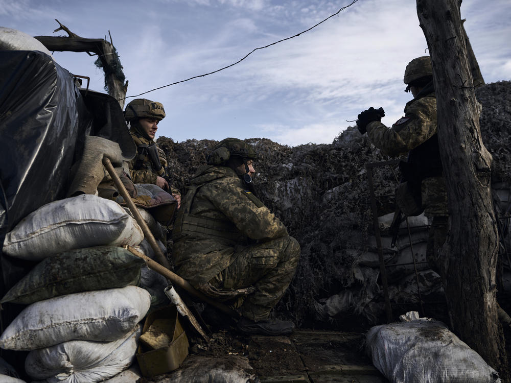 Ukrainian soldiers take position during fights with Russian forces near Maryinka, Donetsk region, Ukraine, on Friday.