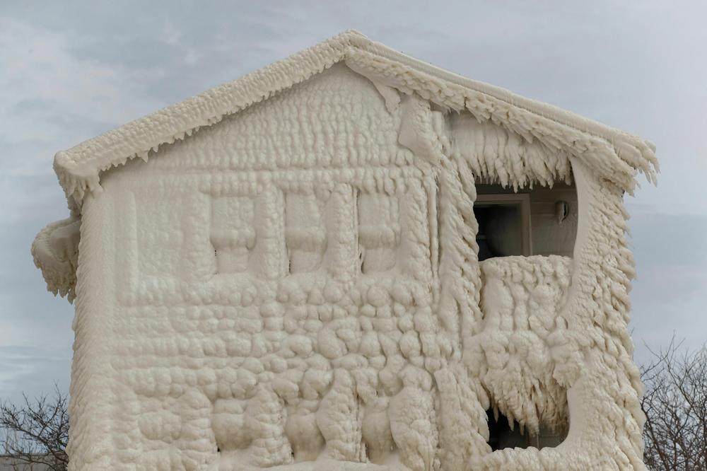 Ice clings to the facade of frozen homes in the waterfront community of Crystal Beach in Fort Erie, Ontario, Canada.