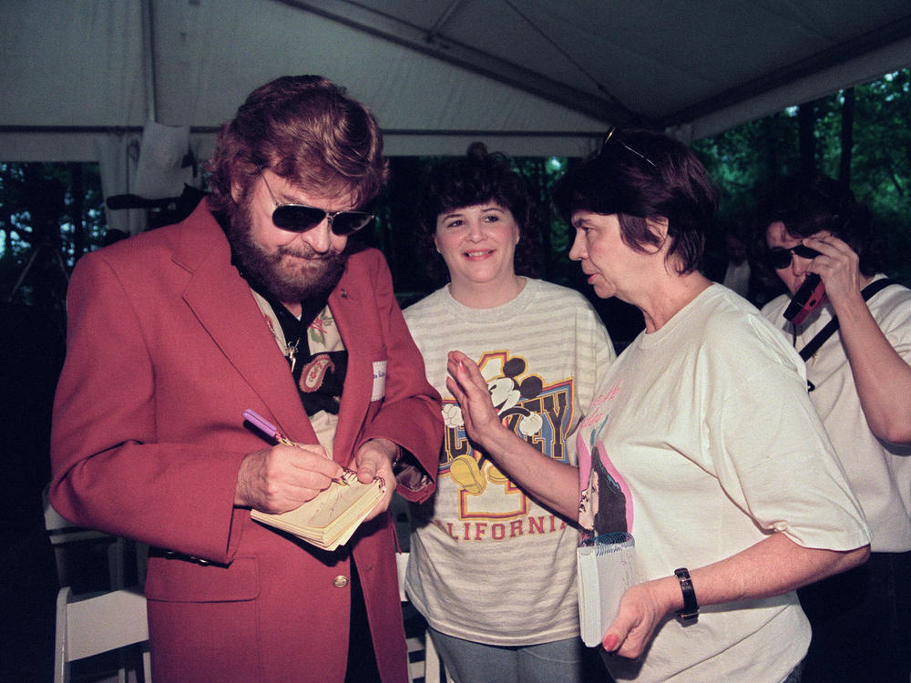 Sam Phillips signs autographs in Memphis, Tenn., in June 1992.