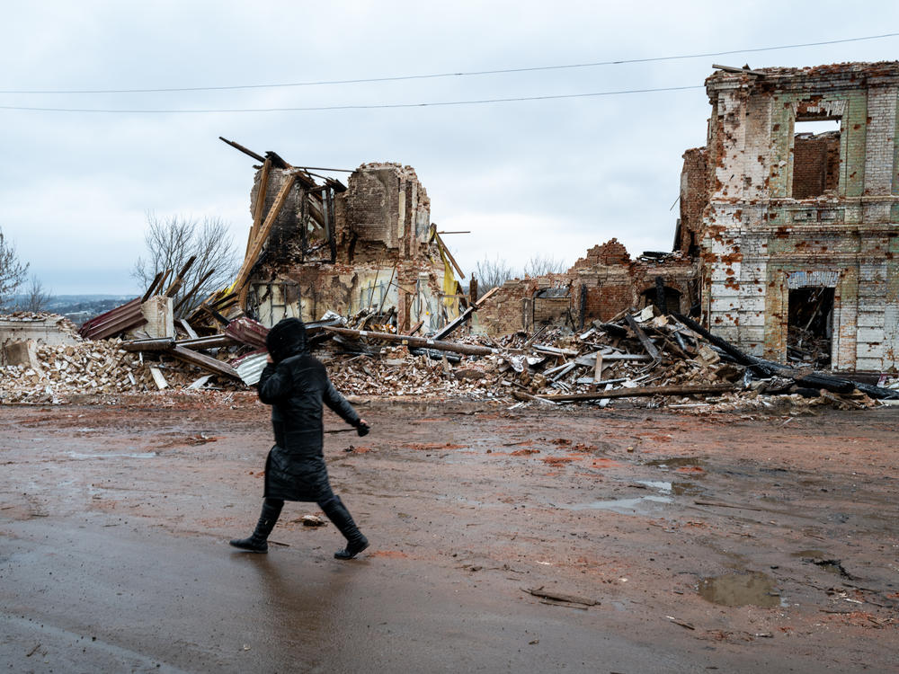 People walk through the town of Kupiansk which experienced regular shelling from the Russians on January 6.